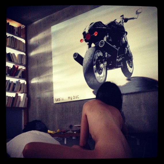 ducati sport classic motorcycle and nude woman inside