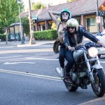 Freedom! Lanakila MacNaughton and passenger (with nipple pasties!) riding Ducati motorcycle in Portland