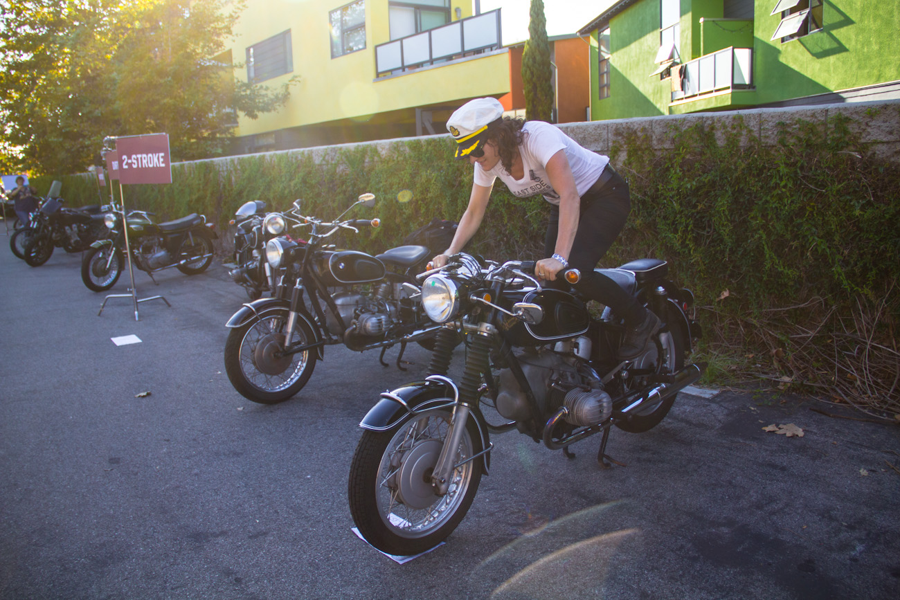 Stacie B London kickstarting her BMW motorcycle